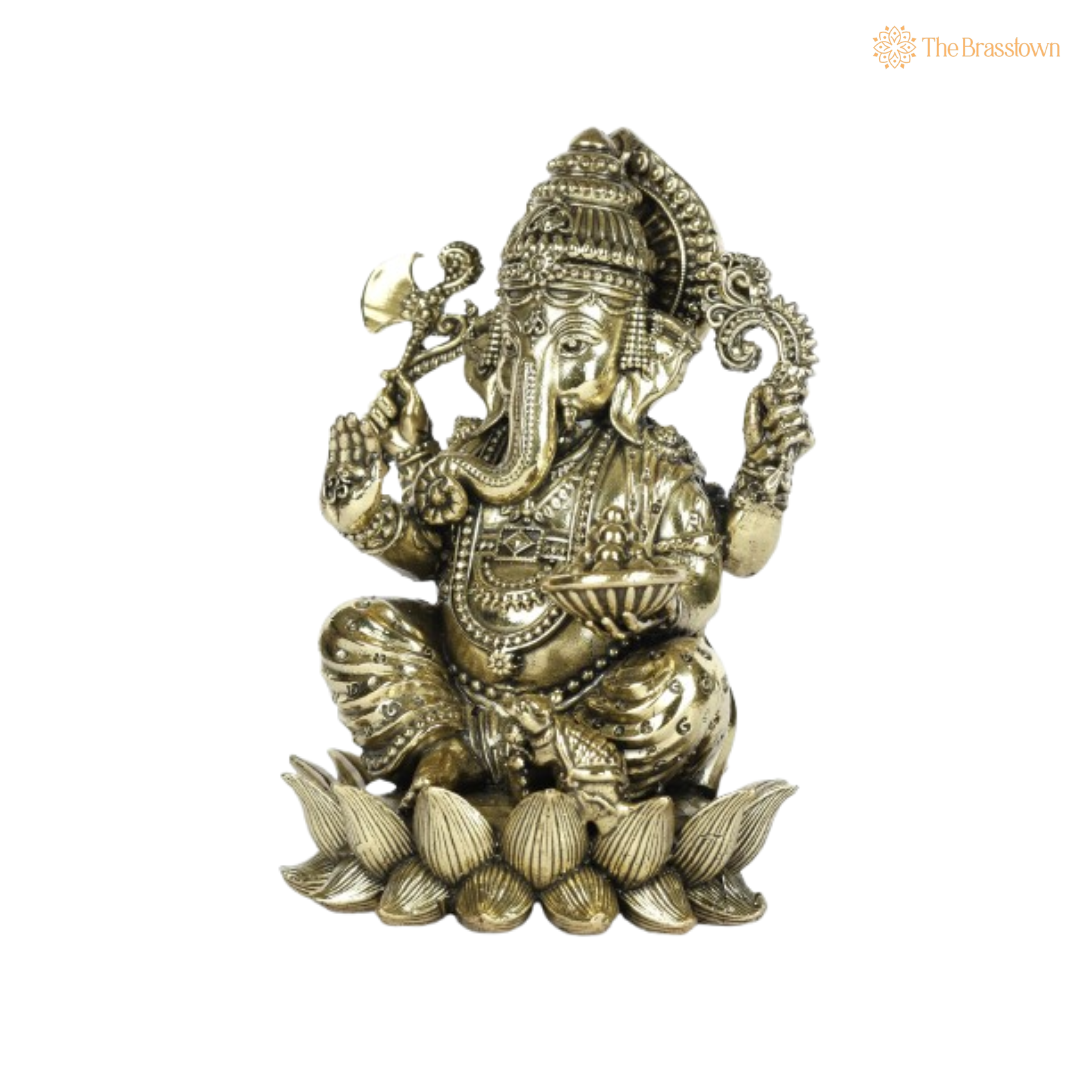 Brass Ganesha Idol Seated on Coconut Base 4 Inch