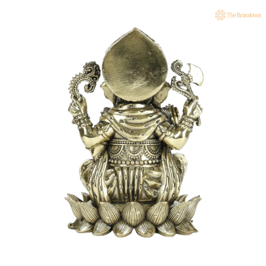 Brass Ganesha Idol Seated on Coconut Base 4 Inch
