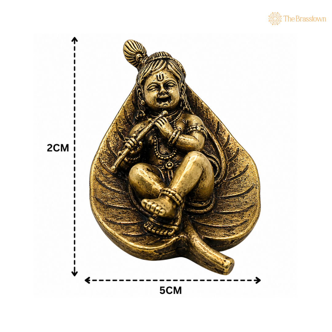 Brass Bal Krishna Idol on Leaf– Lord Krishna Murti (Makhan Chor, Govind, Gopal, Shyamsundar) for Puja, Home Mandir &amp; Décor 1 Inch